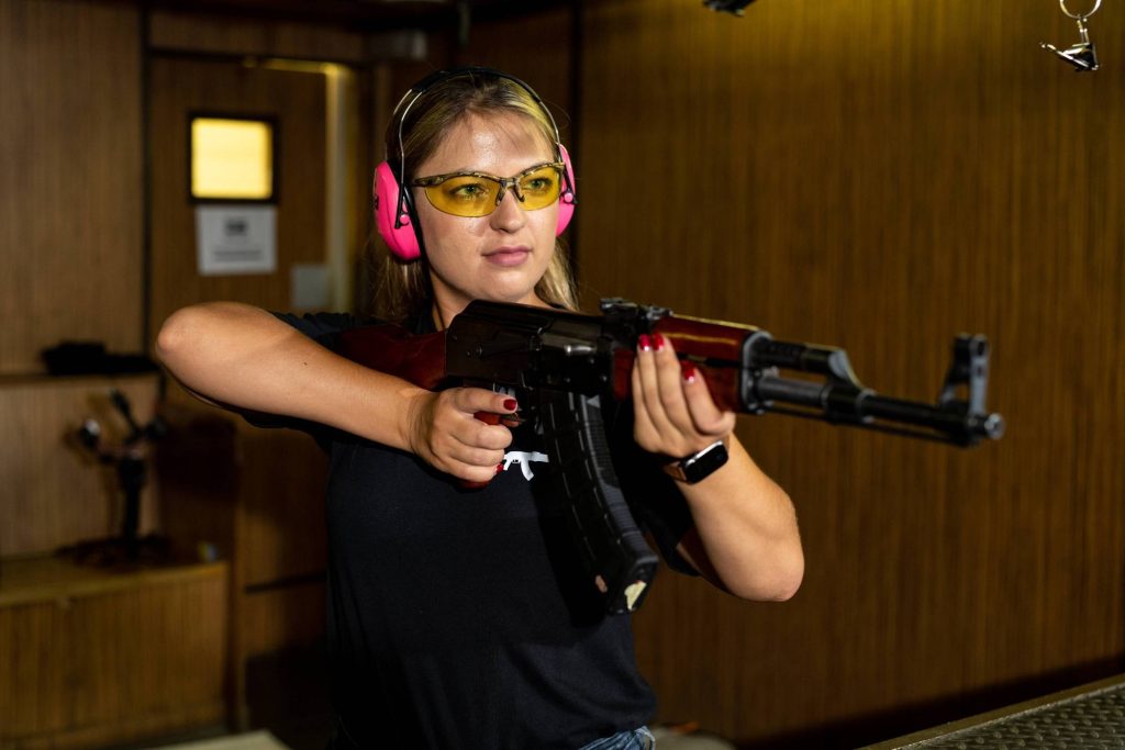 Woman learning to shoot with a shotgun at Gun Fun, Cape Town: Women's Day 2-for-1 Special 2024